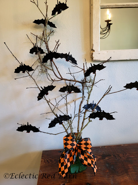 Bat, Branches, and Bows. Share NOW.#Halloween, #halloweendecor, #halloweendecorations, #DollarTreeCraft, #eclecticredbarn